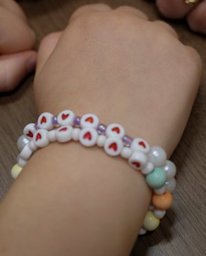This is one of the 2,500 bracelets made and sold by best friends Evelyn Thallemer and Matilda Crosswy, second-grade students at Overbrook Catholic School in Nashville, Tenn., to raise money to buy a therapy dog for The Covenant School, also in Nashville, where a mass shooting took place March 27, 2023. The bracelets feature six heart beads to represent the six victims of the shooting who included three 9-year-olds. Out of about $31,000 the girls raised, $17,000 went to Comfort Connections for a therapy dog for Covenant. A golden retriever puppy was delivered to the school May 23, and it will go through training over the summer months. How the rest of the money is used will be at the discretion of The Covenant School.