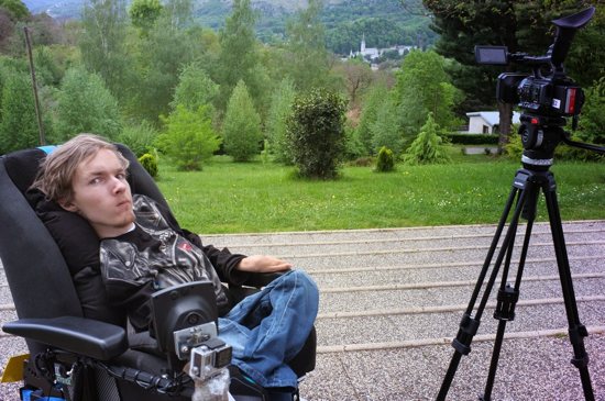 Kamil Cierniak lived with spinal muscular atrophy (SMA), a terminal illness, for 26 years. Despite the disease, he studied in multiple departments of Krakow's universities in Poland. In 2015 Kamil was asked to become a director of the documentary on the international pilgrimage of the Order of Malta to Lourdes sanctuary. He is pictured with his camera on a hill overlooking Lourdes Sanctuary on May 4, 2015 in Lourdes. Cierniak died April 18, 2020.