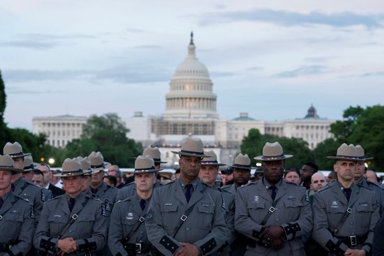 Los Angeles Police Department law enforcement officers attend the National Law Enforcement Officers Memorial Fund's 34th annual candlelight vigil honoring law enforcement officers who died in the line of duty on the National Mall in Washington May 13, 2022.