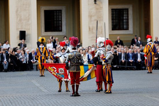 A new member of the Swiss Guard makes an oath to defend the pope and his legitimate successors during a swearing-in ceremony in the San Damaso Courtyard of the Apostolic Palace at the Vatican May 6, 2023. 