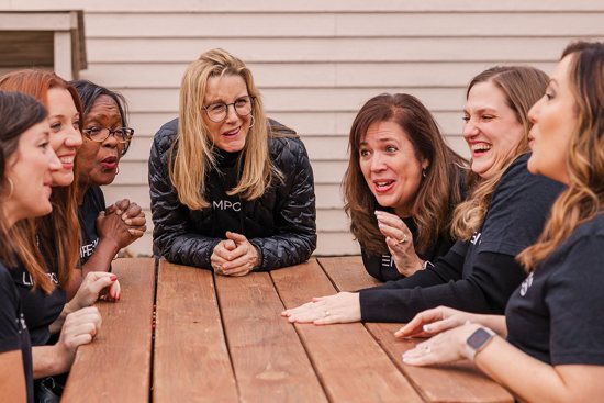 From left to right, social worker Kara West of the Abortion Survivors Network joins abortion survivors Jennifer Milbourn, Karen Causey, Kim Marvin, Delana Brooks, Amy Miles and Denisha Workizer as they share a moment of laughter at the organization’s annual retreat in 2022. The Missouri-based organization is the world's only nonprofit dedicated to serving abortion survivors.