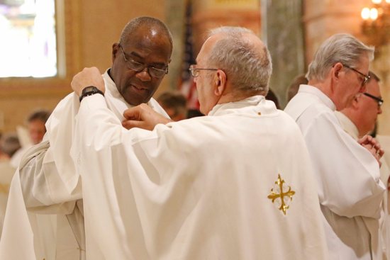 Deacon Francis Cuffie is vested by Msgr. Joseph Malagreca during his ordination to the diaconate at St. Joseph Co-Cathedral in Brooklyn, N.Y., May 25, 2019. The estimated number of permanent deacons in active ministry in U.S. was 13,695 in 2022, the lowest amount since 2011, according to results of new CARA survey.