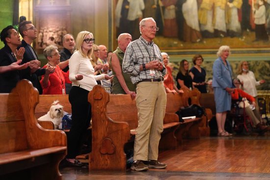 People pray during the closing Mass for the Outreach LGBTQ Catholic Ministry Conference at the Church of St. Paul the Apostle in New York City June 18, 2023. Following the Vatican's working document publication, Catholic groups involved in ministry to persons identifying as same-sex attracted or part of the LGBTQ+ community discuss what they see as their priorities or concerns for the Synod on Synodality.
