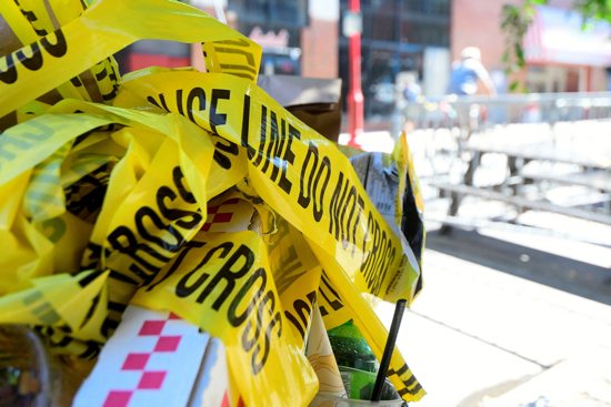 Police tape is pictured near the site of a mass shooting crime scene in Philadelphia in this file photo from June 2022.
