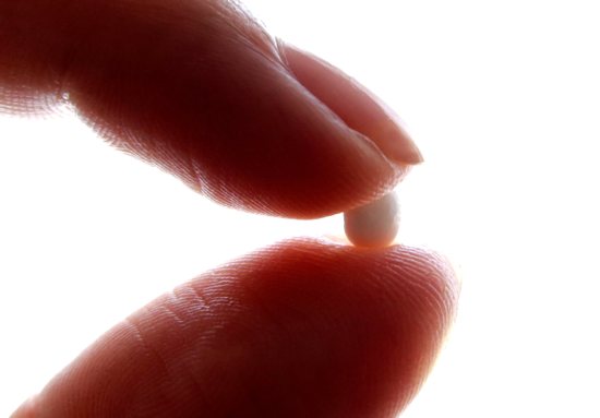 A woman holds a birth control pill in this photo illustration. The Food and Drug Administration announced July 13, 2023, it approved the sale of a birth control pill without a prescription for the first time in the United States -- a move that will increase the availability of oral contraception and impact ongoing debates about abortion policy post-Dobbs.