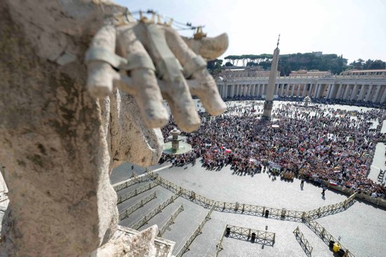 Visitors gather to pray the Angelus with Pope Francis in St. Peter's Square at the Vatican Oct. 1, 2023.