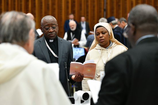 Members of the assembly of the Synod of Bishops gather for morning prayer Oct. 27, 2023, in the Paul VI Audience Hall at the Vatican.