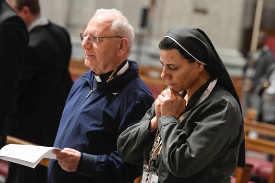 Cardinal Louis Sako, the Iraq-based patriarch of the Chaldean Catholic Church, and Iraqi Sister Caroline Saheed Jarjis, a member of the Daughters of the Sacred Heart of Jesus, the rosary for peace with members of the assembly of the Synod of Bishops in St. Peter's Basilica at the Vatican Oct. 25, 2023.