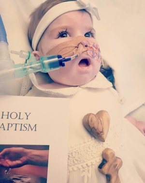 Indi Gregory, an 8-month-old child suffering from a degenerative disease who was at the center of a legal battle in the U.K. to keep her on life support, is pictured Sept. 22, 2023, the day of her baptism. Indi died on Nov. 13, 2023. "I knew she was special from the day she was born," Dean Gregory, her father, said.