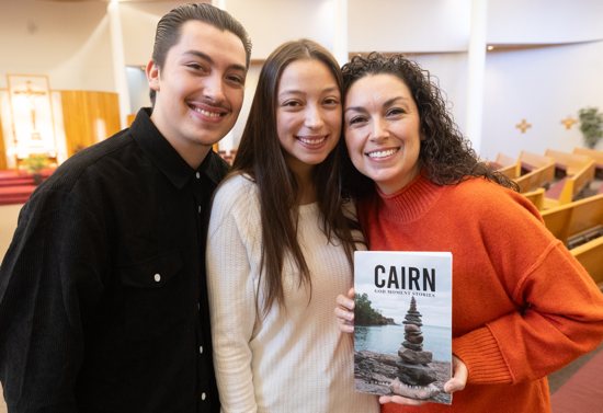 From left, Santiago, Arianna and Stephanie Villanueva-Montoya of St. Rita in Cottage Grove hold a copy of a book they helped publish under the guidance of their pastor, Father Mark Joppa.