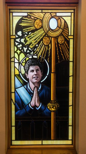 This stained-glass window of Blessed Carlo Acutis was installed Dec. 13, 2023, in St. Anne's Chapel, a 24-hour adoration chapel at St. Louis Parish in Foreston, Minn. It was designed by artist Christi Becker and made by Terhaar Stained Glass Studio in Cold Spring, Minn.
