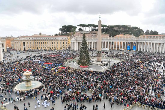 Visitors gather in St. Peter's Square at the Vatican to pray the Angelus with Pope Francis Jan. 1, 2024.