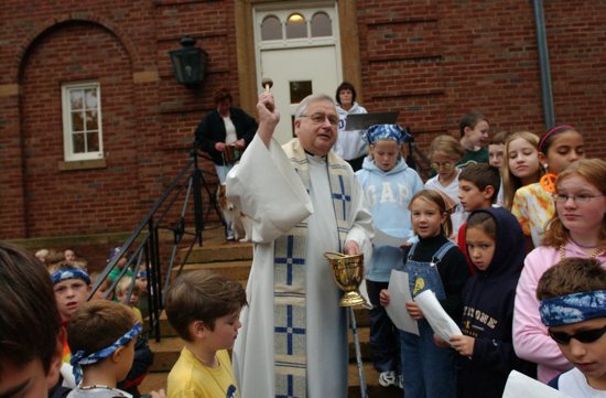 In this file photo from 2002, Father Robert Schwartz blesses animals at Our Lady of Grace in Edina Oct. 4 to celebrate the feast day of St. Francis of Assisi.