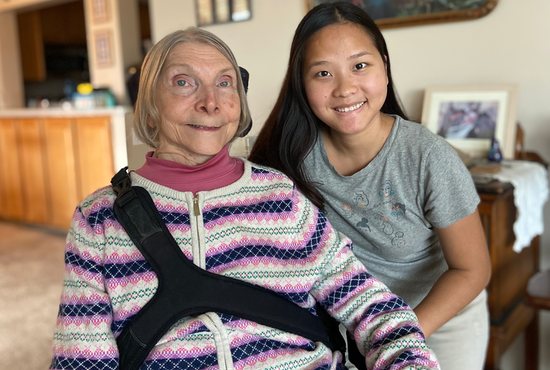 Jean Swenson, left, with her personal care assistant, Pa Di Moua, in Swenson’s apartment in St. Paul.