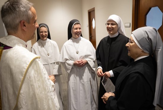 From left, Auxiliary Bishop Michael Izen talks with Sisters Incarnata Apel and Gianna Marie Borchers of the Dominican Sisters of Mary, Mother of the Eucharist, Sister Leanne Luecke of Pro Ecclesia Sancta and Sister Joseph Marie Cruz of Little Sisters of the Poor at the Archdiocesan Catholic Center in St. Paul Feb. 1.