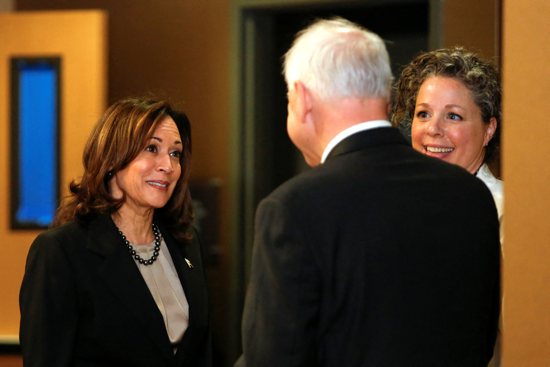 U.S. Vice President Kamala Harris speaks with Dr. Sarah Traxler and Minnesota Gov. Tim Walz as she visits an abortion clinic in Minneapolis March 14, 2024. It was the first time a president or vice president visited an abortion facility.