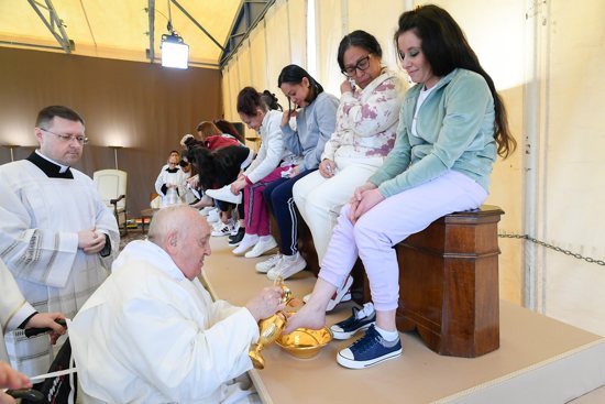 Pope Francis washes the feet of an inmate at the Rebibbia women's prison on the outskirts of Rome as he celebrates the Holy Thursday Mass of the Lord's Supper March 28, 2024. The pontiff washed the feet of 12 inmates at the prison.