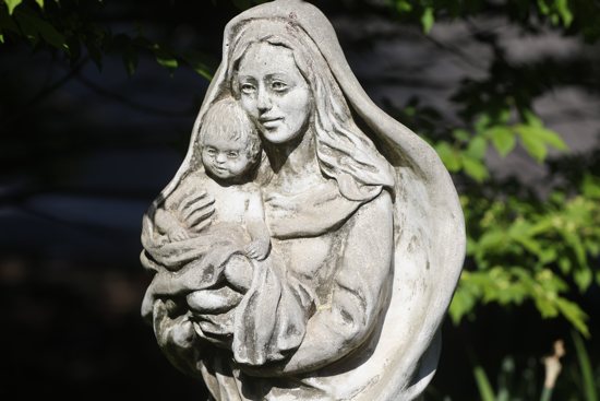 A statue of Mary and the Christ Child is displayed in the garden at Jesus the Good Shepherd Church in Dunkirk, Md., April 28, 2022.