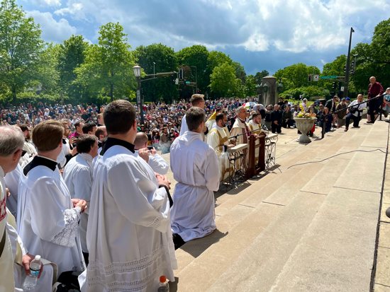 The Source and Summit procession stops at St. Thomas More in St. Paul along its route from The St. Paul Seminary to the Cathedral of St. Paul May 27.