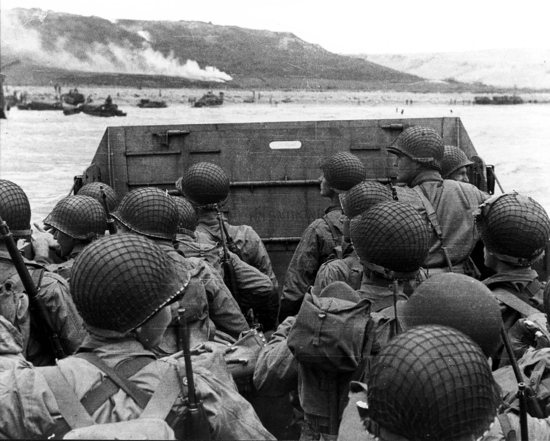 U.S. Army troops in an LCVP landing craft approach Normandy's "Omaha" Beach on D-Day in Colleville Sur-Mer, France, June 6 1944.