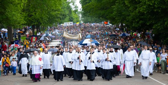The Source and Summit Eucharistic Procession makes its way along Summit Avenue in St. Paul on its way to the Cathedral of St. Paul in St. Paul.