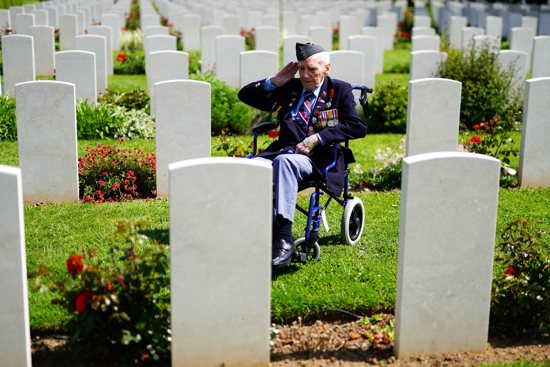 Royal Air Force veteran Bernard Morgan, 100, from Crewe, England, salutes the fallen ahead of the Royal British Legion Service of Commemoration to mark the 80th anniversary of D-Day June 5, 2024, at Bayeux War Cemetery in Normandy, France,.