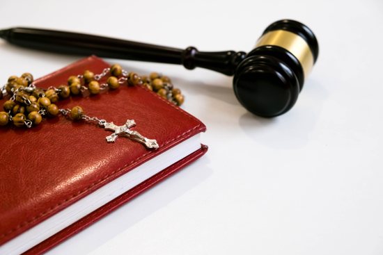 Gavel and rosary and bible