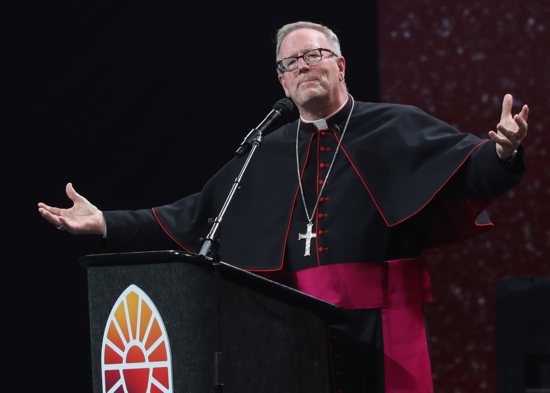 Bishop Robert E. Barron of Winona-Rochester, Minn., speaks during the July 20, 2024, revival night of the National Eucharistic Congress at Lucas Oil Stadium in Indianapolis. Bishop Barron was among critics of a drag performance during the Paris Olympics opening ceremony July 26 who said it parodied the Last Supper and mocked Christianity. 