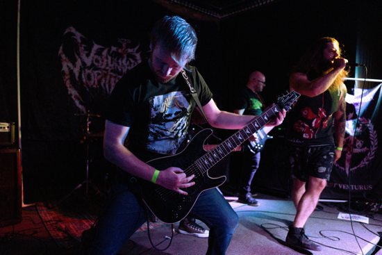 Guitarist Jacob Kanclerz and vocalist Conner Luttig, founding members of the deathcore metal band Voluntary Mortification, are pictured performing in an undated photo.
