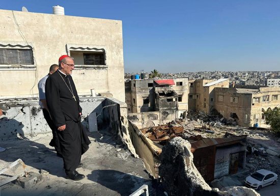 Cardinal Pierbattista Pizzaballa, the Latin patriarch of Jerusalem, walks through the ruins of buildings in Gaza City. He visited northern Gaza Strip May 16-19, 2024, during Pentecost. In a letter to the faithful Sept. 26, Cardinal Pizzaballa called for a day of prayer and penance on the anniversary of the Oct. 7, 2023, attack on Israel by Hamas and the start of the Israel-Hamas war.
