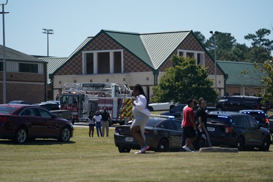 Law enforcement officers and firefighters work at the scene of a mass shooting at Apalachee High School in Winder, Ga., Sept. 4, 2024.
