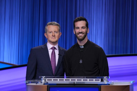 Holy Cross Father Steve Jakubowski, parochial vicar St. Ignatius Martyr Catholic Church in Austin, Texas, right, is pictured on the set of the "Jeopardy!" game show with host Ken Jennings in Los Angeles May 31, 2024. Father Jakubowski appeared on the popular game show Sept. 19, taking third place with $2,000 in winnings.