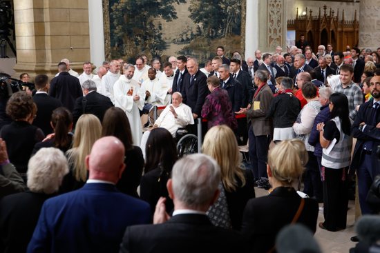 Pope Francis greets people as he arrives for a meeting with bishops, priests, deacons, religious, seminarians and pastoral workers at Luxembourg's Cathedral of Notre-Dame Sept. 26, 2024.