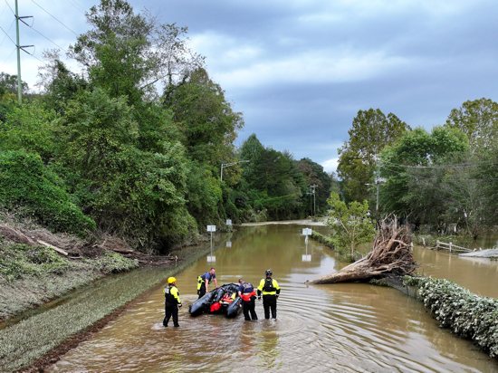 A drone view Sept. 29, 2024, shows rescue personnel working in a flooded area in Asheville, N.C., following the passing of Tropical Storm Helene. The storm made landfall at 11:10 p.m. (Eastern time) Sept. 27 in Florida's Big Bend as a Category 4 hurricane and was downgraded to a tropical storm the next morning.