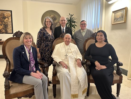 Pope Francis poses for a photo with a delegation from New Ways Ministry, including transgender and intersex Catholics, during a meeting at his residence at the Vatican Oct. 12, 2024. Pictured from left are Cynthia Herrick, Laurie Dever, Deacon Ray Dever, Michael Sennett and Nicole Santamaria.