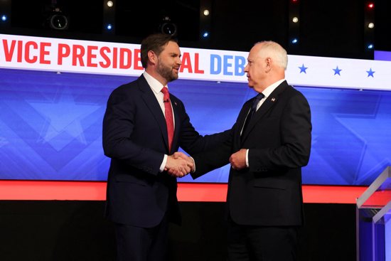 Republican vice presidential nominee Sen. JD Vance of Ohio and Minnesota Gov. Tim Walz, the Democratic vice presidential nominee, great each other before taking part in their first and only debate at the CBS Broadcast Center in New York City Oct. 1, 2024.