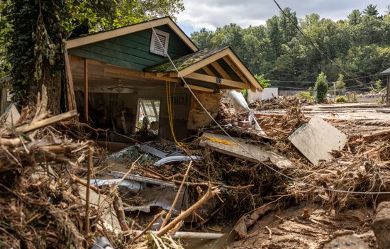 A destroyed house with a car under it in Chimney Rock, N.C., is seen Sept. 29, 2024, after the remnants of Hurricane Helene hit the town. The storm made landfall on Sept. 26 in Florida's Big Bend region as a Category 4 hurricane and was downgraded to a tropical storm the next morning.