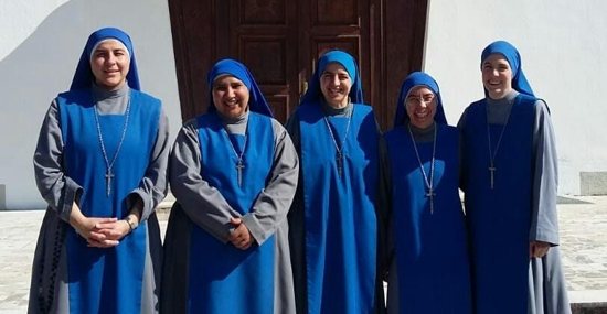 Servant of the Lord and Virgin of Matará Sister Muire Chroi Iosa, at far right, stands with fellow sisters in front of their Monastery of St. Joseph in Albania.