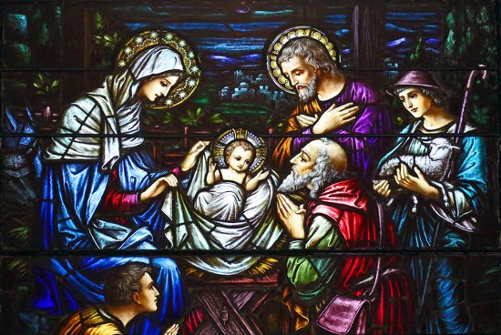 This stained-glass window at St. Aloysius Church in Great Neck, N.Y., depicts Jesus in a manger surrounded by Mary, Joseph and three shepherds.