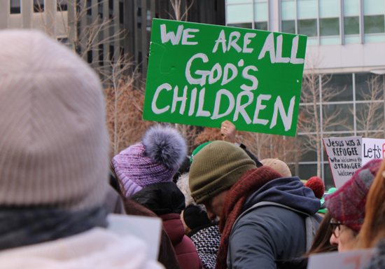 A participant holds a sign during a Jan. 25, 2025, interfaith rally in support of immigrants at Love Park in downtown Philadelphia. The event, organized by nonprofit New Sanctuary Movement, challenged city officials to push back on Trump administration policies that restrict immigration and include plans for mass deportations of unauthorized immigrants. 