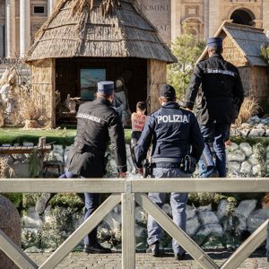 A protester associated with the women’s movement FEMEN storms the Nativity scene in St. Peter's Square at the Vatican Dec. 27, 2024. The organization said on its website that the act was intended to to raise awareness "of Russia’s war crimes against Ukrainian children." 