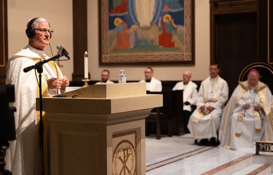 Father Francis Hoffman, aka "Father Rocky," addresses those gathered at the chapel at St. John Vianney College Seminary in St. Paul Oct. 15, 2024, for a live broadcast of Relevant Radio's “Family Rosary Across America,” which includes prayers for West St. Paul-based NET Ministries.