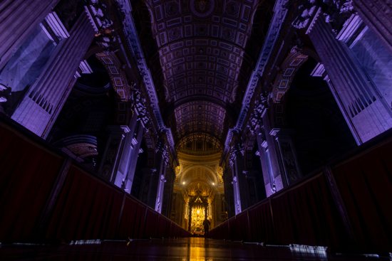The interior of St. Peter's Basilica is illuminated with special lighting Feb. 16, 2025, during a contemplative evening walkthrough of the basilica after its closure to the general public for participants in the Jubilee of Artists and the World of Culture.