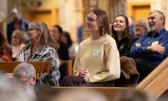 Katie Hall of St. Peter in Forest Lake listens to a presentation at Parish Staff Formation Day Feb. 20 at Pax Christi in Eden Prairie.