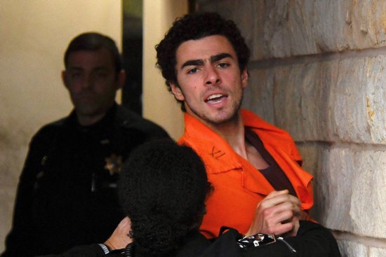 Luigi Mangione, 26, a suspect in the New York City killing of UnitedHealth executive Brian Thompson, arrives for an extradition hearing at Blair County Court House in Hollidaysburg, Pa., Dec. 10, 2024. 