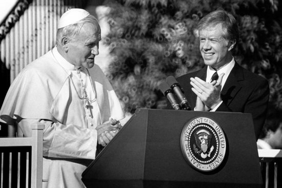 Pope John Paul II greets members of the U.S. Supreme Court on the north lawn of the White House Oct. 5, 1979, as President Jimmy Carter applauds. While in Washington, the pope expressed support for the second Strategic Arms Limitation Treaty, known as SALT II, at a time when U.S. bishops were voicing condemnation of nuclear proliferation. The pontiff also called on South American governments to respect the rights of their citizens in a speech to the Organization of American States and affirmed life during a Mass on the Mall.