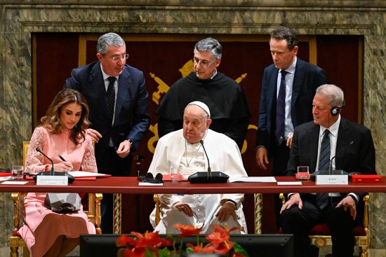 Queen Rania of Jordan, left, signs a document during the world leaders’ summit on children’s rights at the Vatican Feb. 3, 2025. Sitting and looking on are Pope Francis, center, and former U.S. Vice President Al Gore, right. Standing from left to right are: Angelo Chiorazzo, founder of the "Auxilium" social cooperative; Franciscan Father Enzo Fortunato, president of the Pontifical Committee for the World Day of Children; and Aldo Cagnoli, vice president of the same committee. 
