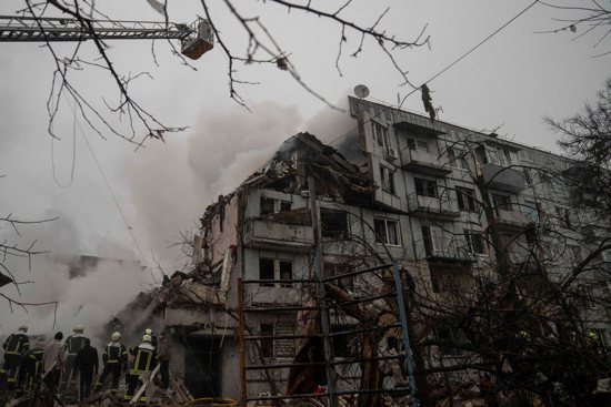 Rescuers work at the site of an apartment building in Poltava, Ukraine, Feb. 1, 2025, that was hit by a Russian missile strike amid Russia's attack on the country.