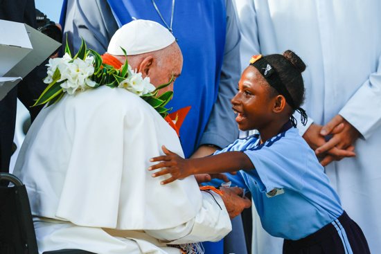 A child hugs Pope Francis during his visit to the Holy Trinity Humanistic School in Baro, Papua New Guinea, Sept. 8, 2024.A child hugs Pope Francis during his visit to the Holy Trinity Humanistic School in Baro, Papua New Guinea, Sept. 8, 2024.