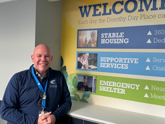 Jamie Verbrugge, president and CEO of Catholic Charities Twin Cities, begins a tour April 4 of the nonprofit’s Dorothy Day Place in downtown St. Paul.